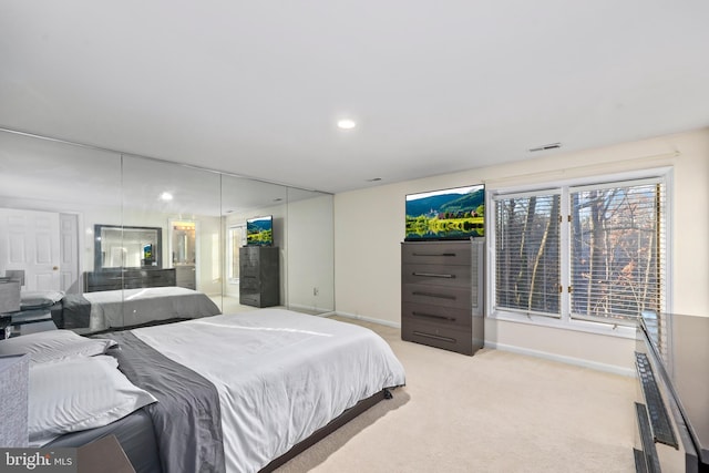 bedroom with recessed lighting, baseboards, visible vents, and light carpet