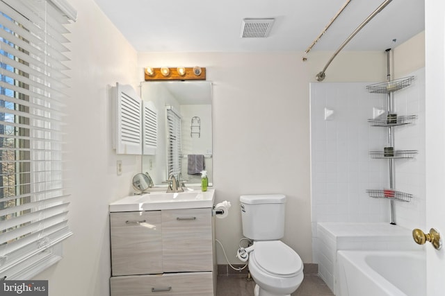 full bathroom with visible vents, baseboards, washtub / shower combination, toilet, and vanity