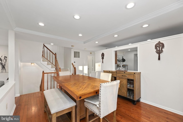 dining space with recessed lighting and crown molding