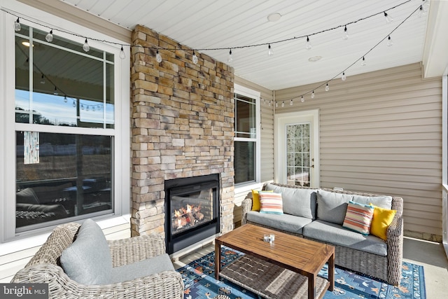 view of patio / terrace featuring an outdoor living space with a fireplace