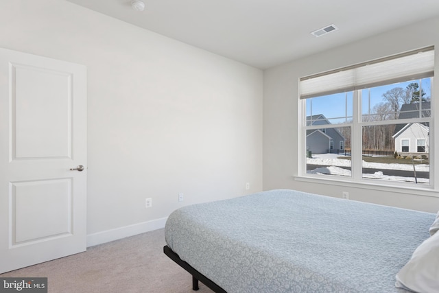 bedroom with baseboards, carpet floors, and visible vents