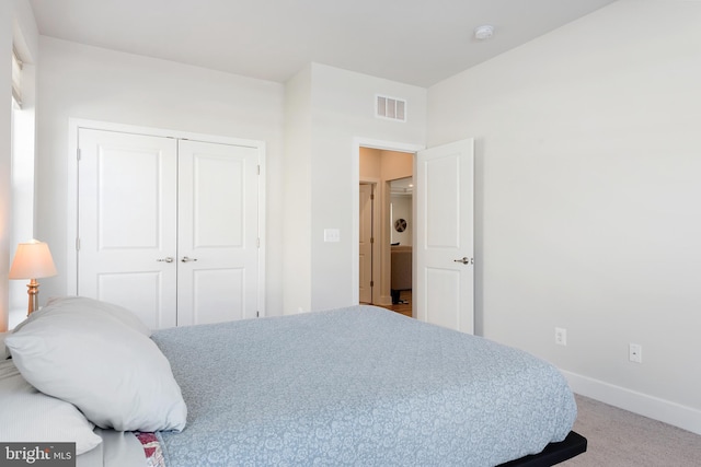 bedroom featuring visible vents, baseboards, a closet, and carpet flooring