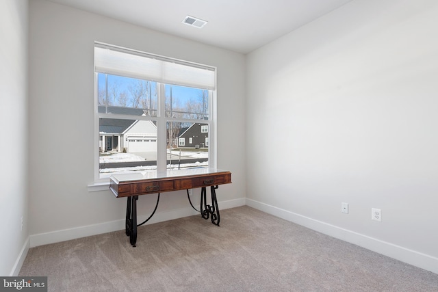 office space with visible vents, carpet floors, and baseboards