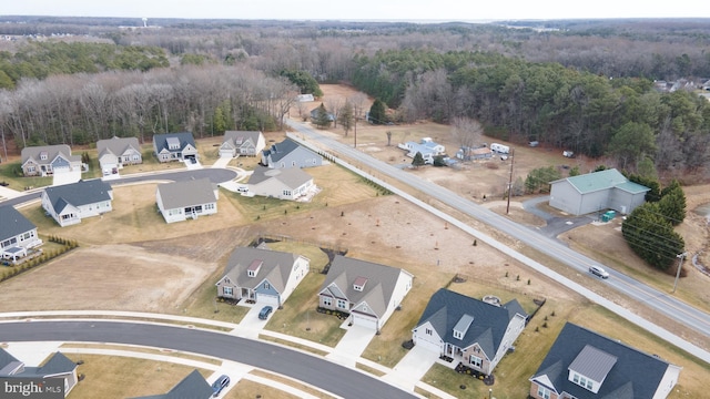 aerial view with a residential view and a view of trees