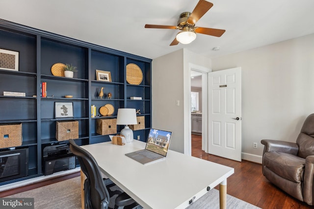 office space featuring dark wood-style floors, baseboards, and a ceiling fan