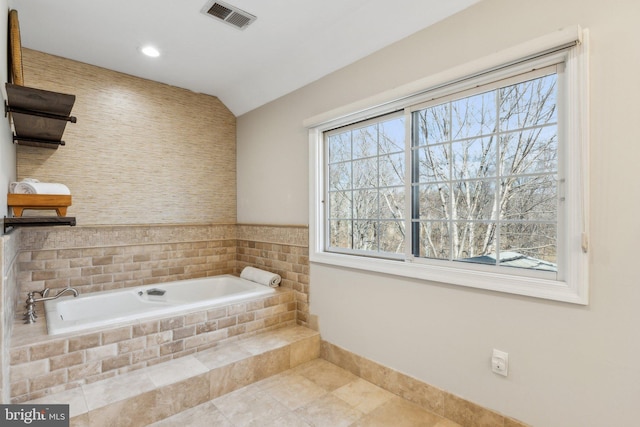 full bath featuring tile patterned flooring, visible vents, baseboards, recessed lighting, and a bath