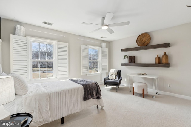 bedroom featuring multiple windows, carpet, visible vents, and baseboards