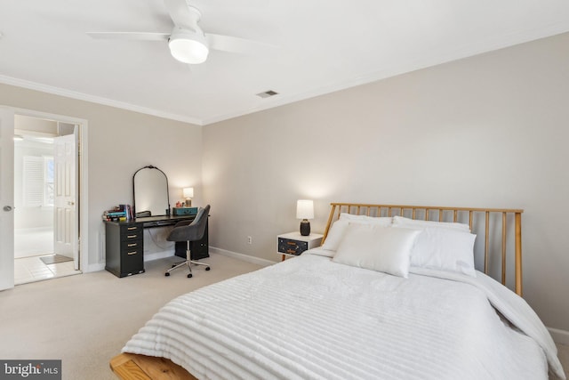 bedroom featuring visible vents, ensuite bath, carpet floors, crown molding, and baseboards