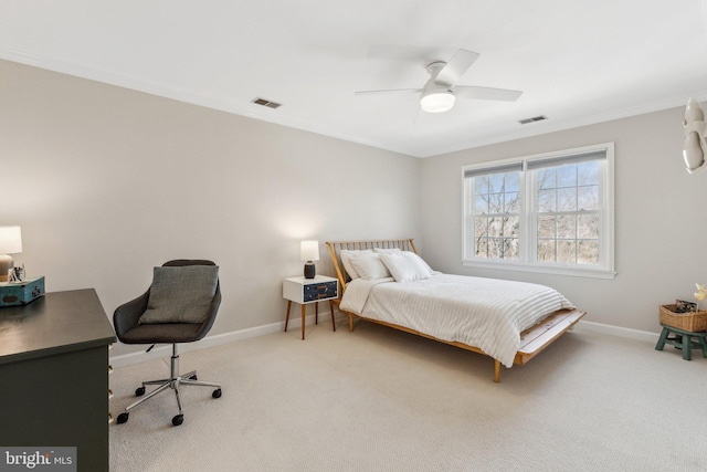 carpeted bedroom featuring visible vents, ceiling fan, baseboards, and ornamental molding