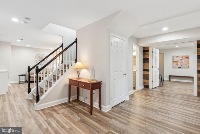 interior space featuring stairway, recessed lighting, light wood-type flooring, and baseboards