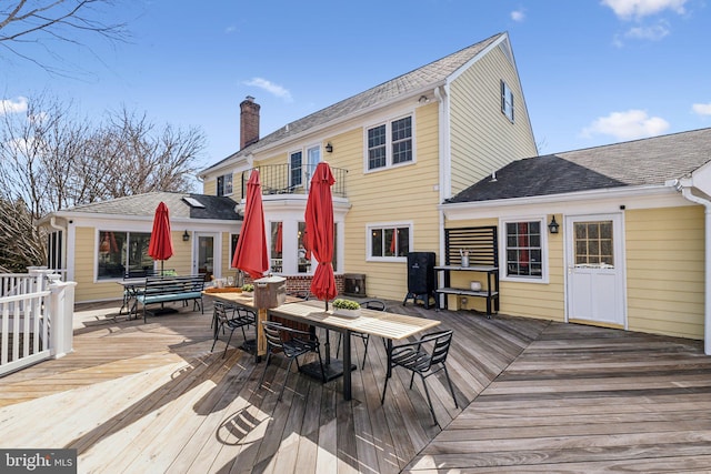 deck featuring outdoor dining area