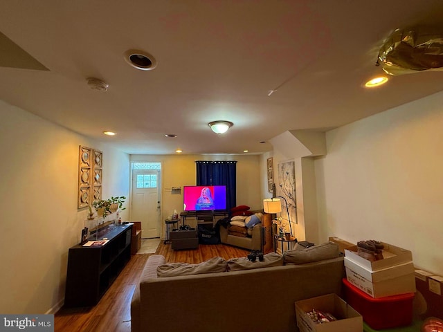 living area with recessed lighting and wood finished floors