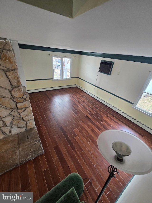 unfurnished living room with visible vents and wood finished floors