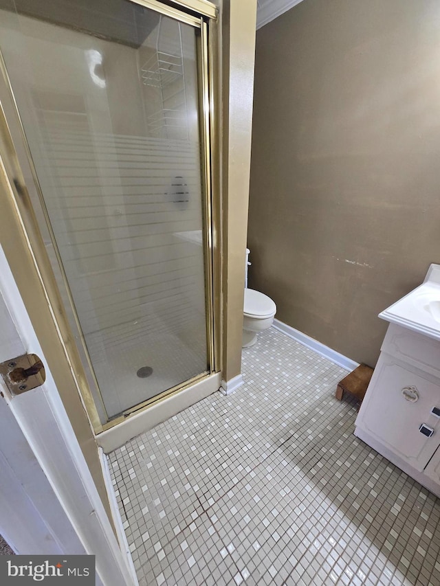 full bathroom featuring vanity, toilet, a shower stall, and tile patterned flooring