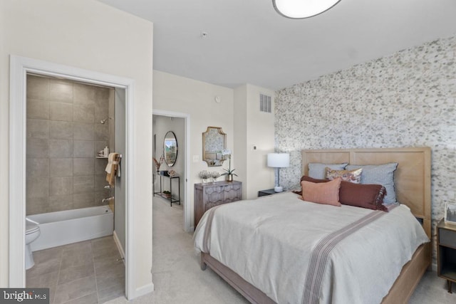 tiled bedroom featuring visible vents, carpet floors, an accent wall, and wallpapered walls