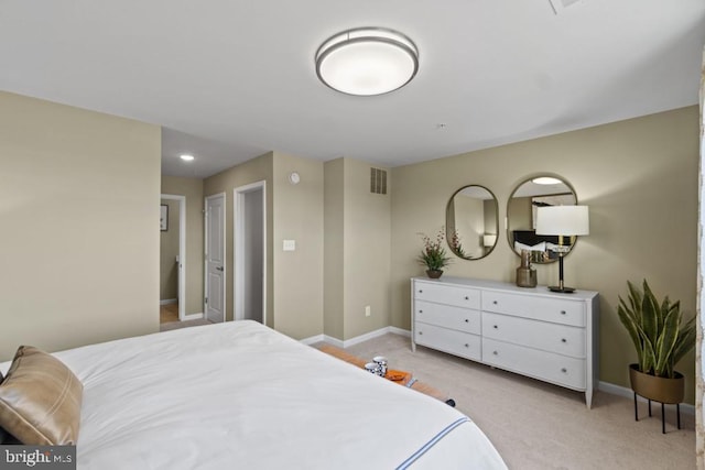 bedroom featuring light colored carpet, baseboards, and visible vents