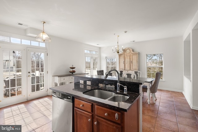 kitchen with visible vents, an island with sink, a sink, stainless steel dishwasher, and french doors