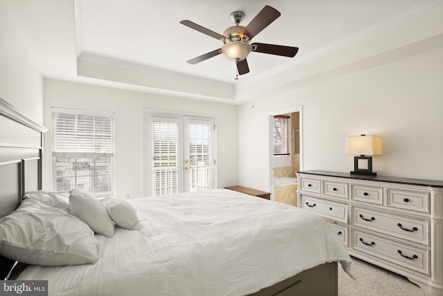 bedroom with a raised ceiling, ornamental molding, a ceiling fan, and access to outside