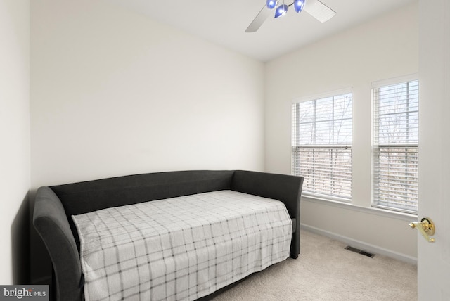 bedroom with ceiling fan, carpet, visible vents, and baseboards