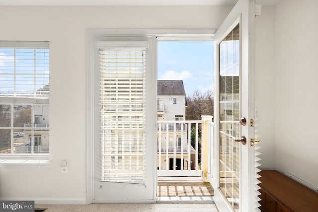 doorway to outside featuring baseboards