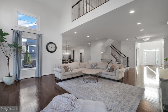 living room with recessed lighting, stairs, baseboards, and wood-type flooring