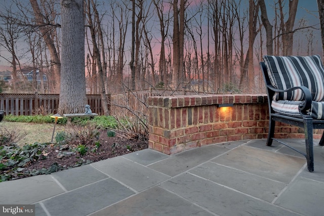 view of patio featuring fence