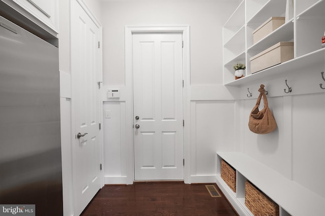 mudroom with visible vents and dark wood-style flooring