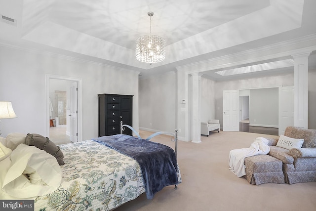 carpeted bedroom with a tray ceiling, visible vents, and ornate columns