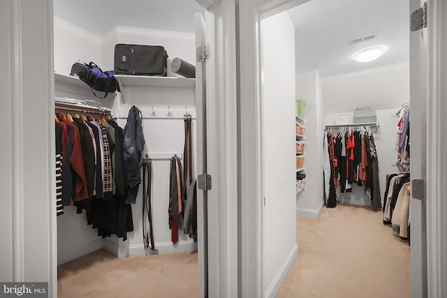 spacious closet with visible vents and carpet