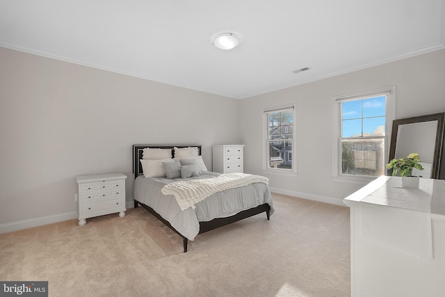 bedroom with baseboards, light carpet, and ornamental molding