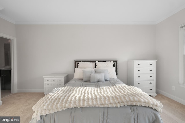 bedroom featuring crown molding, light colored carpet, and baseboards