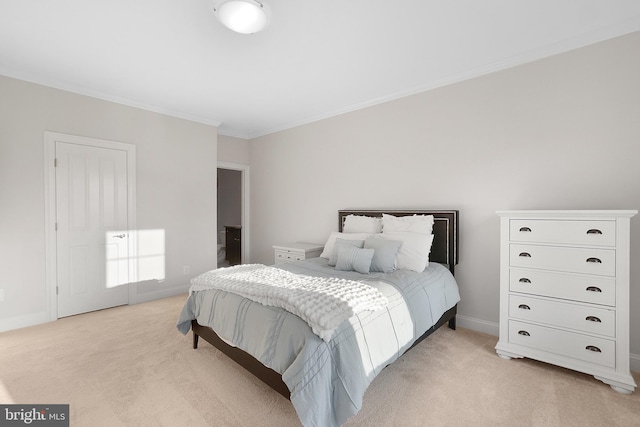 bedroom featuring light colored carpet, crown molding, and baseboards