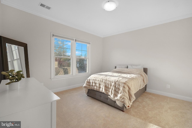 bedroom featuring baseboards, light carpet, and ornamental molding