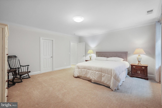 carpeted bedroom featuring visible vents, baseboards, and crown molding