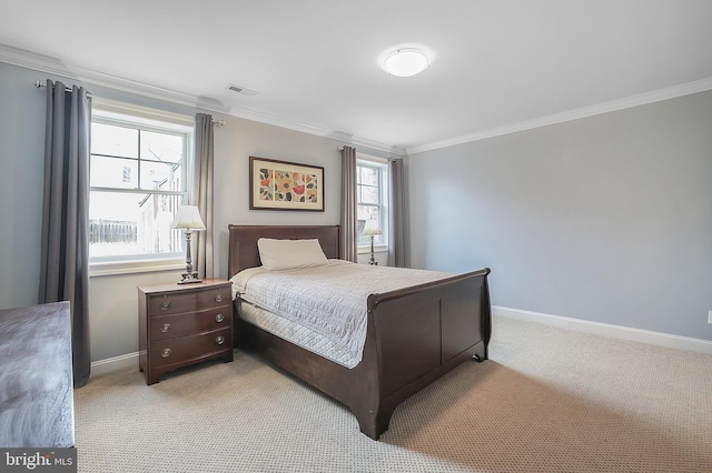 bedroom with crown molding, light colored carpet, and baseboards