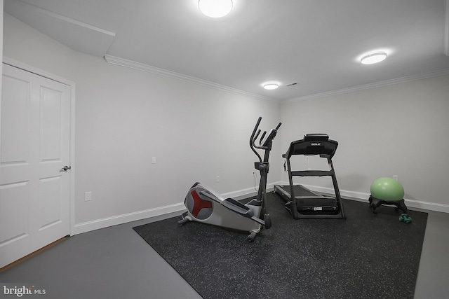 exercise area with crown molding and baseboards