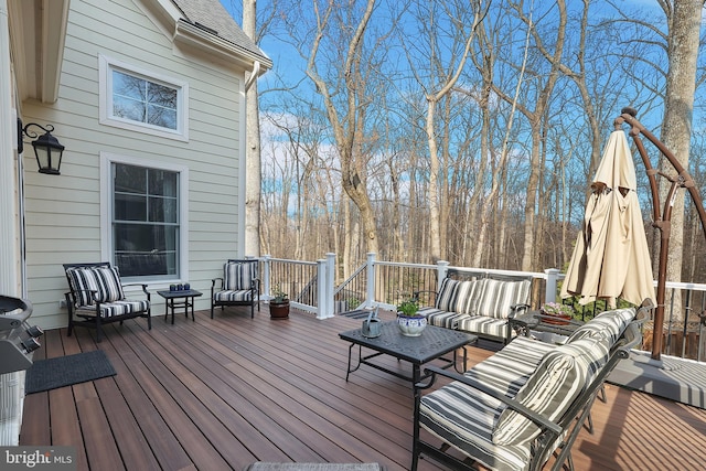 wooden terrace featuring an outdoor living space