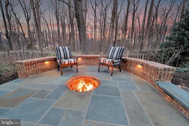 view of patio / terrace with an outdoor fire pit