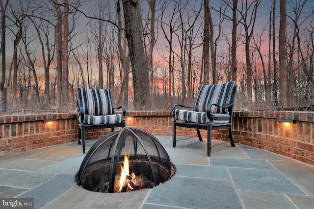 view of patio featuring an outdoor fire pit