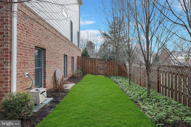 view of yard with a fenced backyard