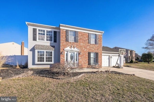 colonial house with brick siding, a front lawn, fence, concrete driveway, and a garage