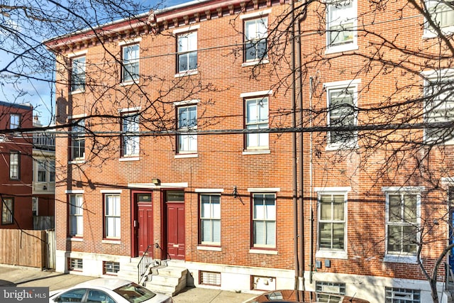 exterior space with brick siding