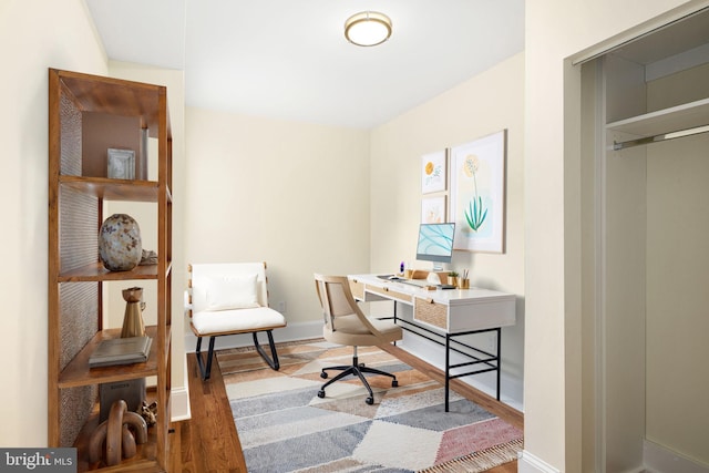 office area featuring wood finished floors and baseboards