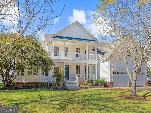 neoclassical home with a balcony, driveway, covered porch, a front lawn, and a garage