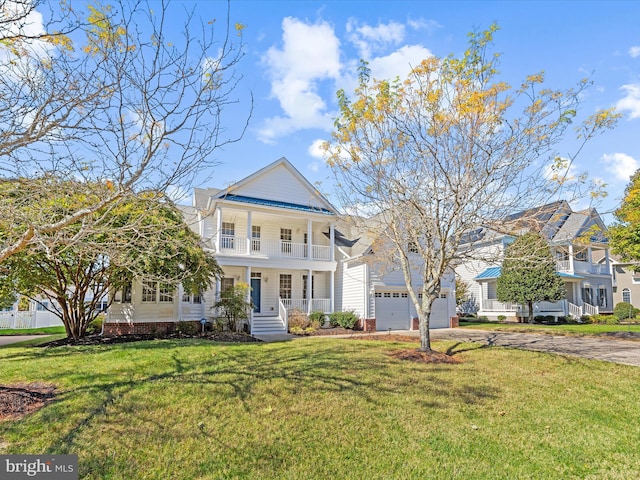 view of front of property featuring driveway, a porch, a front yard, a garage, and a balcony