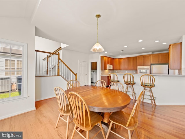 dining area with recessed lighting, stairway, light wood-style flooring, and baseboards