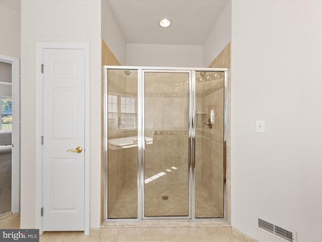 full bathroom featuring visible vents and a shower stall