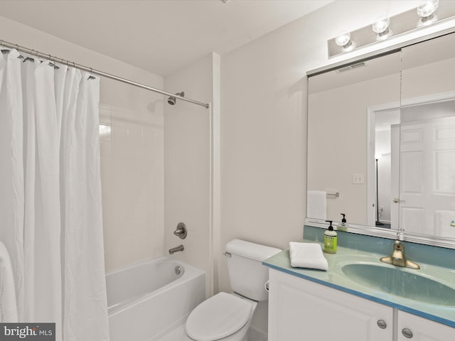 bathroom with visible vents, toilet, vanity, and shower / tub combo