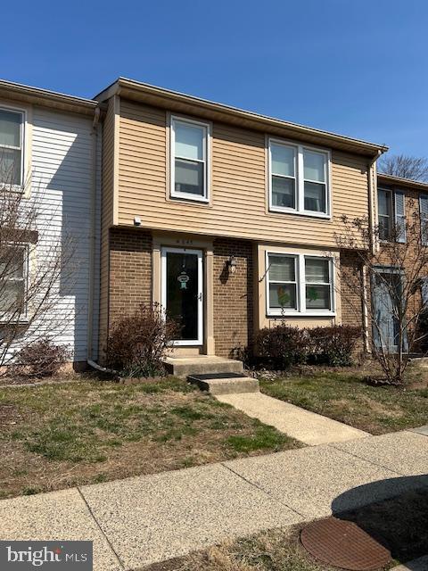 view of front of house with brick siding