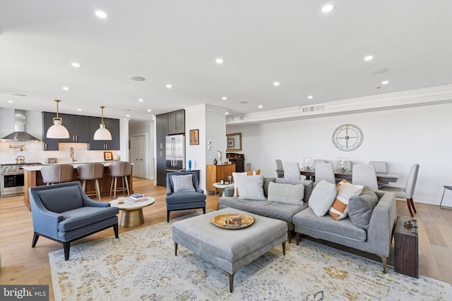191 Presidential Blvd Unit R1018-1019, Bala Cynwyd, PA 19004 - living area with light wood finished floors, crown molding, recessed lighting, and bar